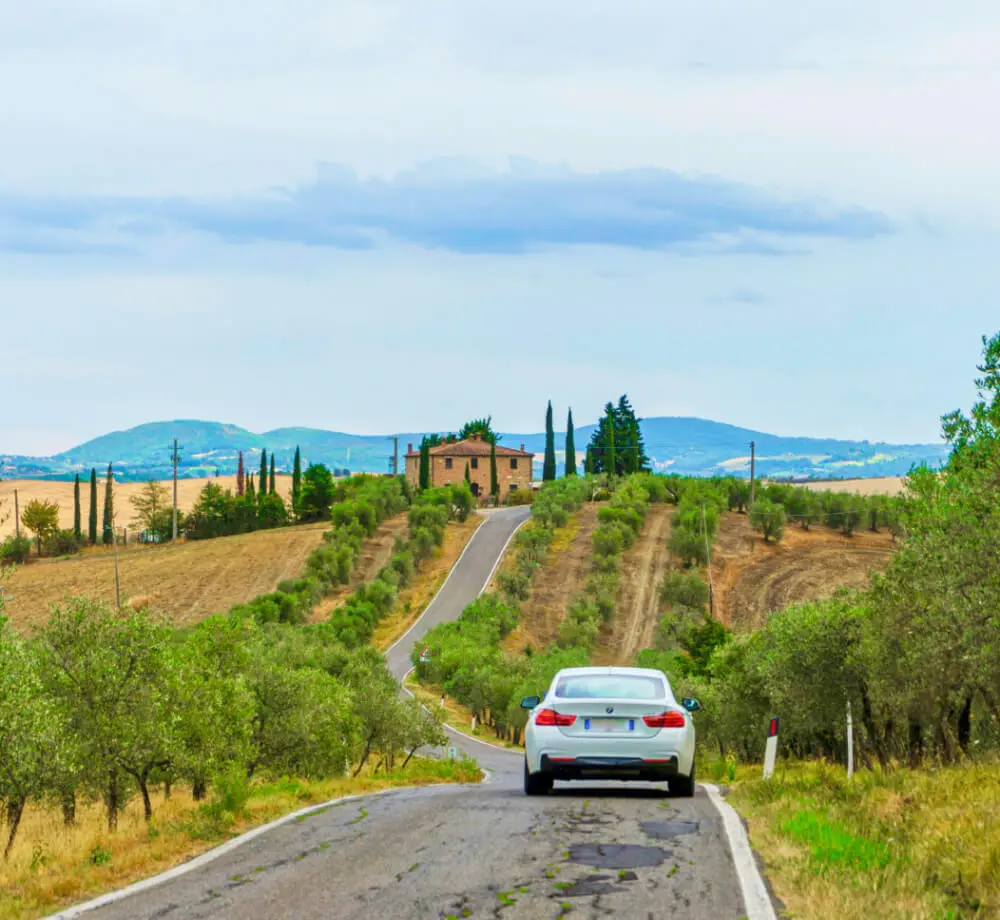 Map and road sign for Tuscan day trip planning