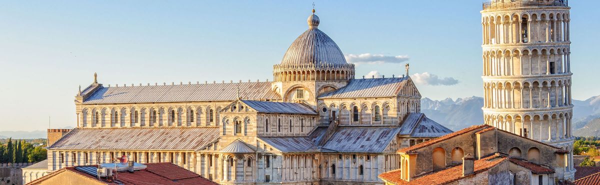 Piazza dei Miracoli lawns with Pisa monuments in the background